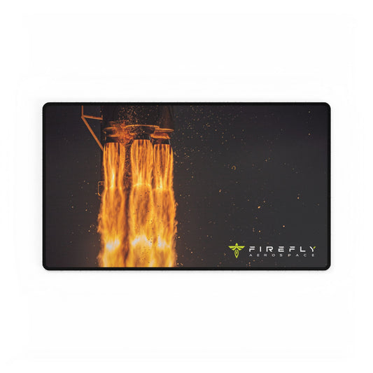 A rectangular gaming mouse pad with rounded corners featuring a fiery orange and yellow rocket exhaust graphic on a black background, with the FIREFLY AIRSPACE logo in the bottom right corner.