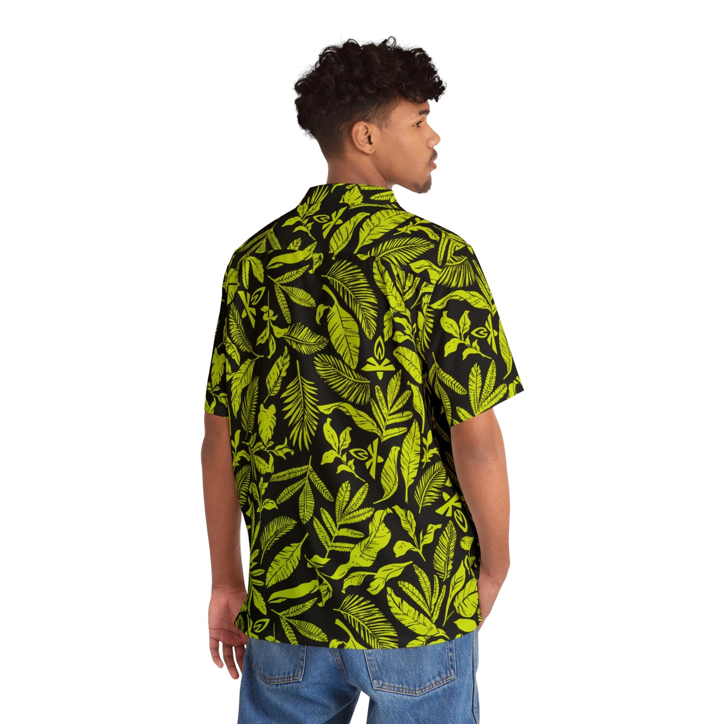 Person wearing a black and green leaf patterned shirt on a white background