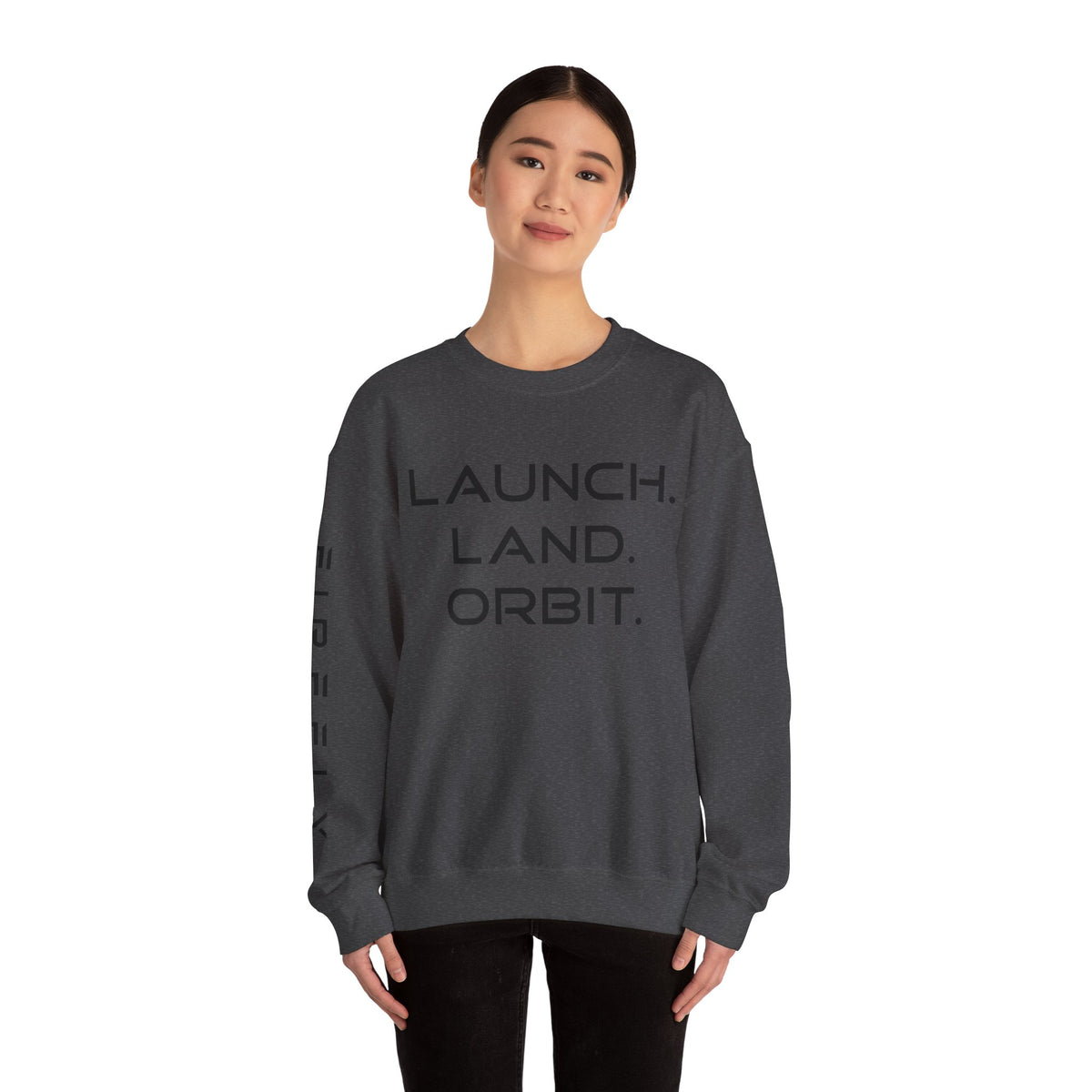 Person wearing a dark gray sweatshirt with 'Heir' text on a white background