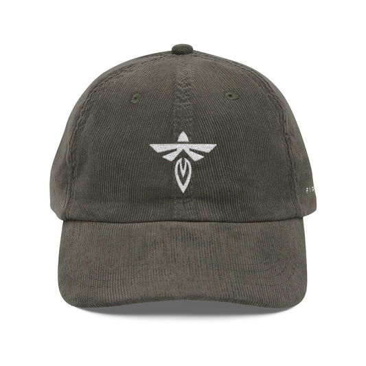 Olive cap with a white logo on a white background