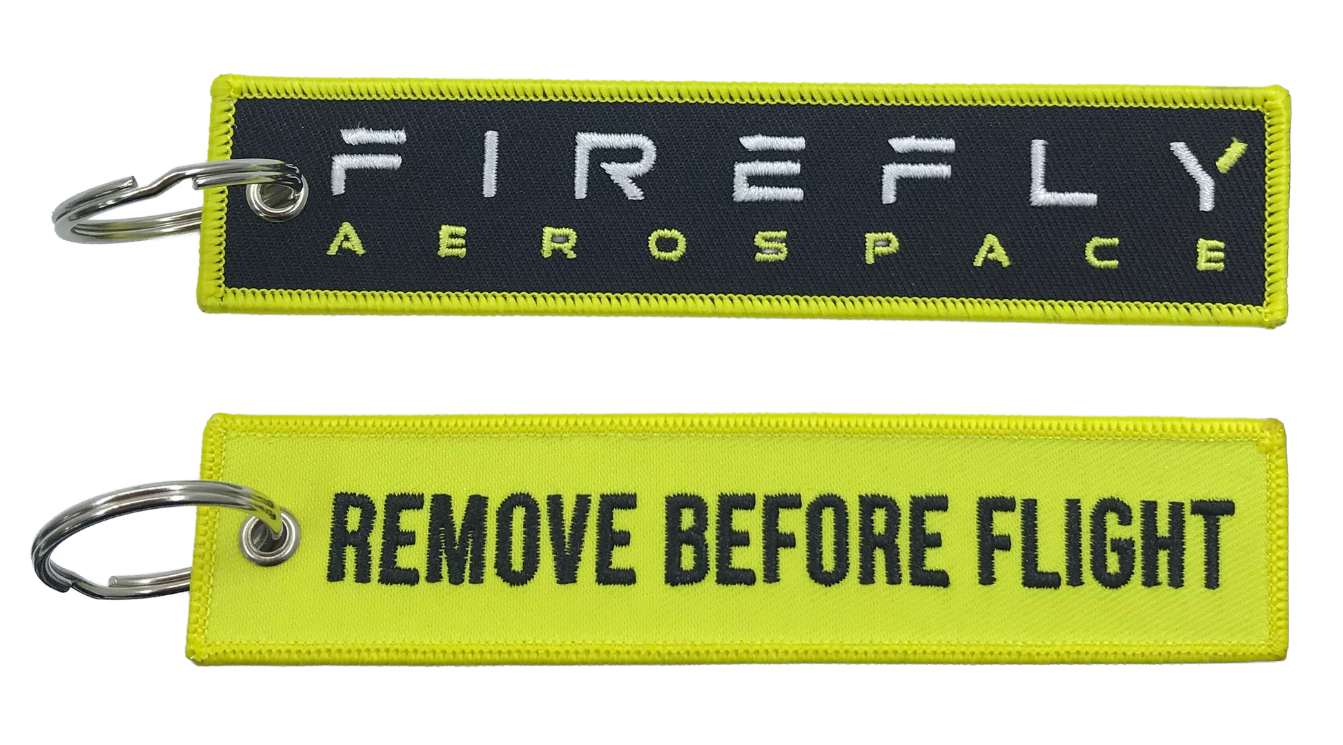 Two keychains with 'Firefly Aerospace' and 'Remove Before Flight' text on a white background.