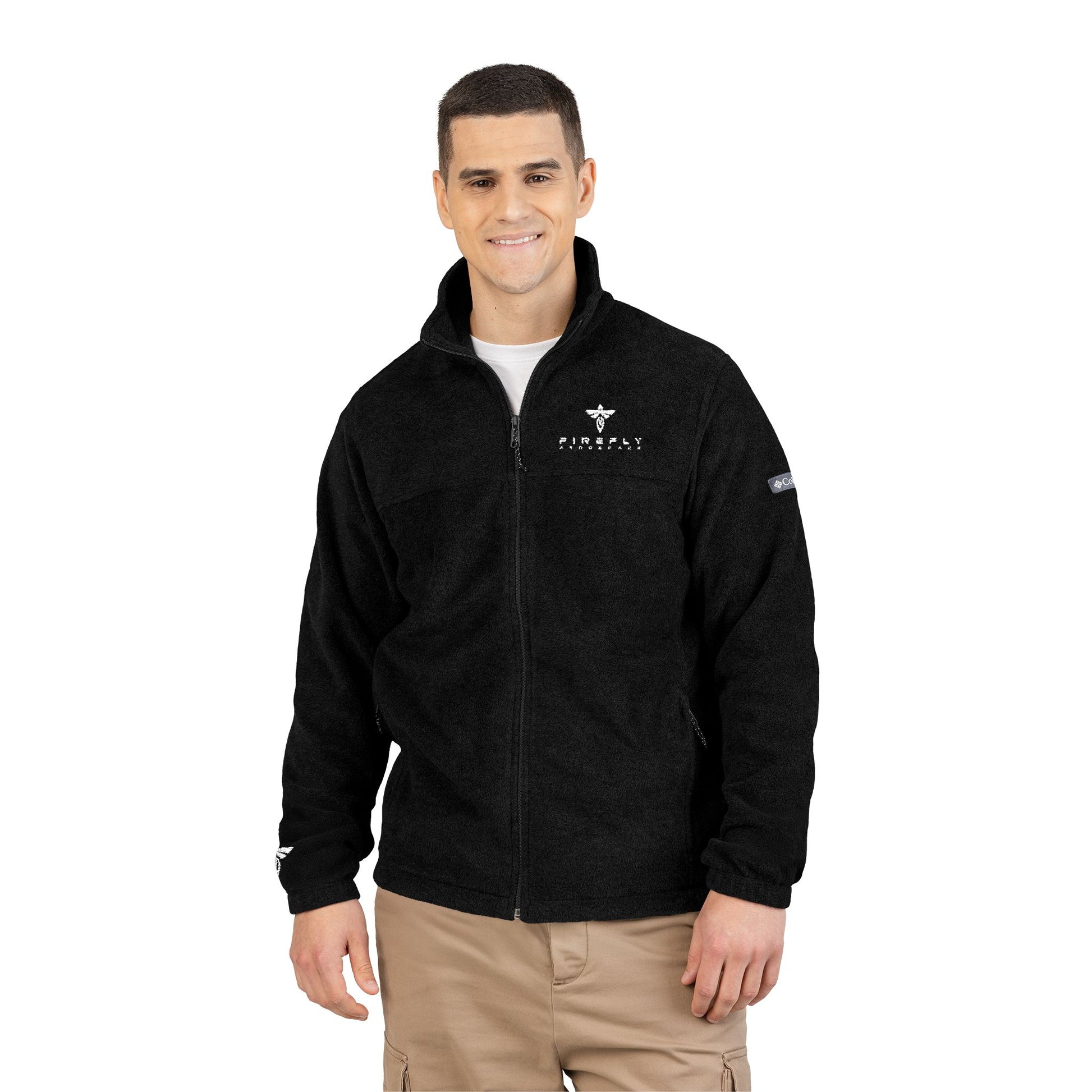 Man wearing a black jacket with logos on a white background
